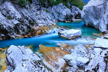 the crystalclear Water of River Soča cutes deep into Limestonerocks, autumn in Kobarid, Slovenia