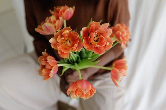 A black woman with fowers