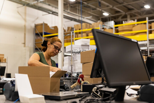 E-Commerce Worker at Workstation 