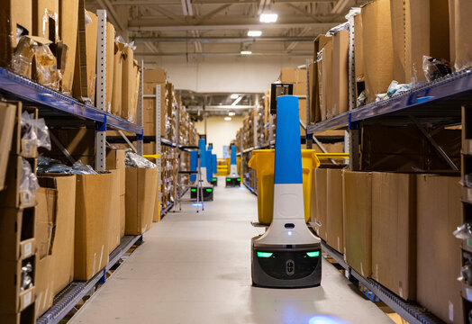 Three Robots stopped in Ecommerce  Warehouse 
