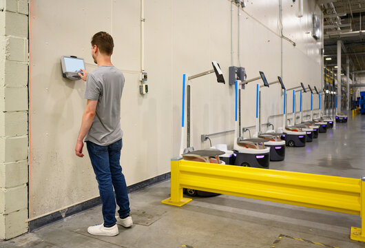  checking in on time clock at warehouse factory 