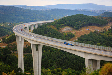 Fototapeta na wymiar A1 Highway Bridge wrap around a mountain, Kastelec, Slovenia