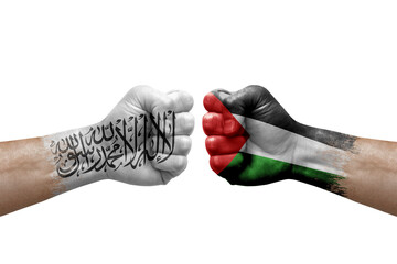 Two hands punch to each others on white background. Country flags painted fists, conflict crisis concept between afghanistan and palestine