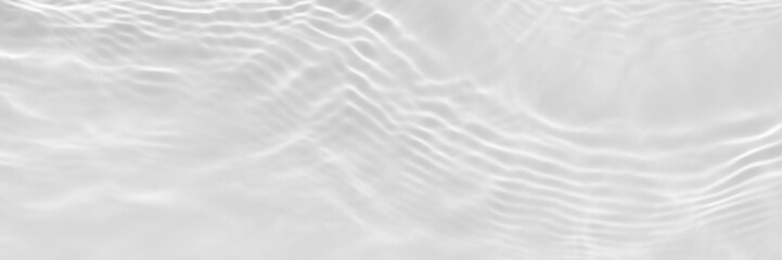 Fototapeta na wymiar Water texture with sun reflections on the water overlay effect for photo or mockup. Organic light gray drop shadow caustic effect with wave refraction of light. Long banner with empty space.