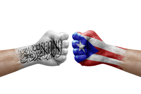 Two hands punch to each others on white background. Country flags painted fists, conflict crisis concept between afghanistan and puerto rico