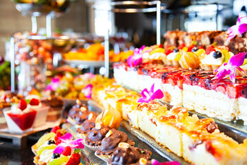 sweet buffet with confectionery bar, pastries and fruits, homely baked cake pies and high sugar sweets, craft dessert, coctail bar.