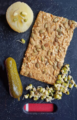 healthy food, grain bread with sour milk cheese and sprouts
