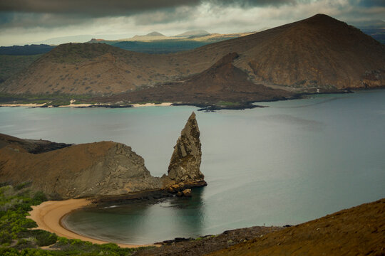 The iconic Pinnacle Rock in the volcanic Bartolome Island, Galapagos Archipelago, under a stormy weather