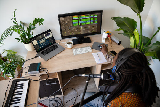 Musician Playing Guitar At Home Studio