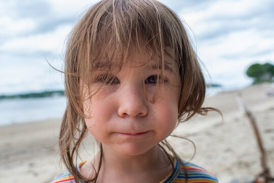 Cute Portrait of Little Girl on the Beach