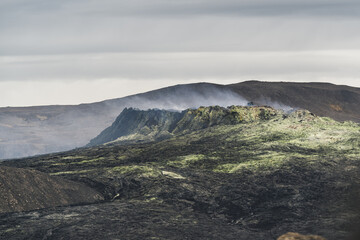 Sulphuric landscape and smoky volcano.