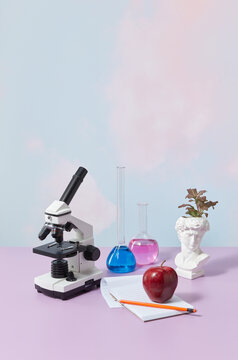 Microscope and red apple