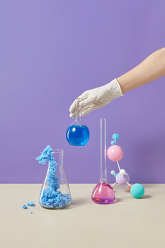 Scientist in glove holding test tube
