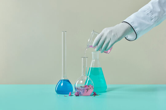 Scientist pouring liquid into test tube