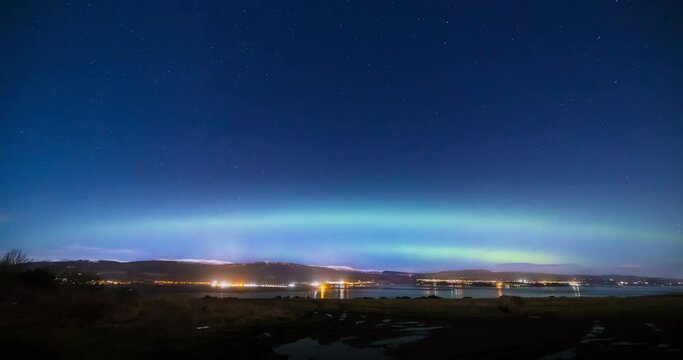 a view of the aurora borealis in the north west highlands of scotland during a clear spring night