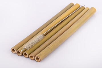 Bamboo straws on a white background. Ecological bamboo straws. Thanks to these bamboo straws, we can be a more environmentally conscious society. Say no to plastic.