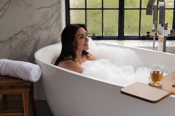 Woman taking a bubble bath 