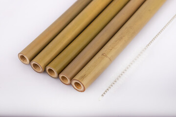 Bamboo straws on a white background. Ecological bamboo straws. Thanks to these bamboo straws, we can be a more environmentally conscious society. Say no to plastic.