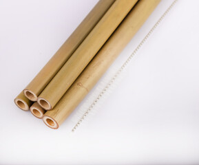 Bamboo straws on a white background. Ecological bamboo straws. Thanks to these bamboo straws, we can be a more environmentally conscious society. Say no to plastic.