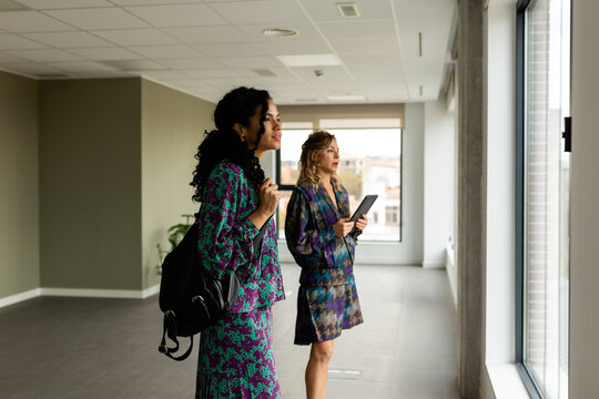 Elegant women looking at new workspace to rent