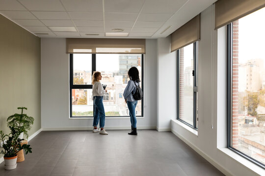 Women at empty office to rent