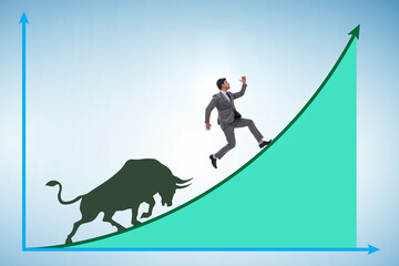 Businessman in illustration of bullish market