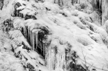 Detail of frozen waterfall with many icecles.