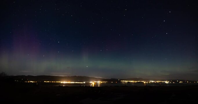 a view of the aurora borealis in the north west highlands of scotland during a clear spring night