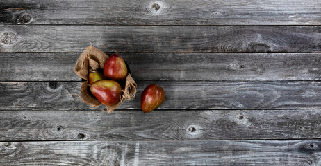 Overhead view of ripe pears on old wood table