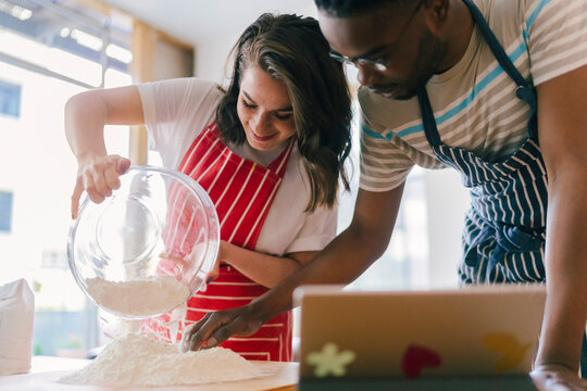 Young Couple Backing together at Home