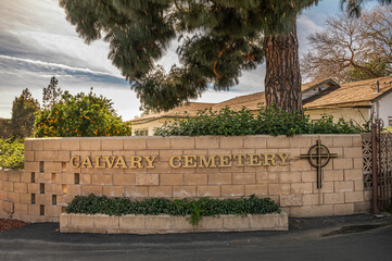 Santa Barbara, California, USA - February 8, 2022: Calvary Cemetery. Closeup of golden entrance...