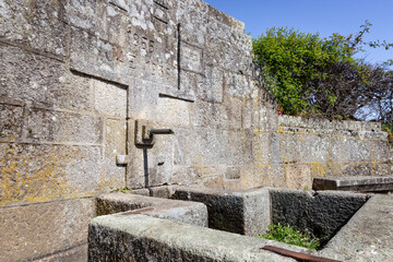 an antique stone made water fountain in Vila Pouca de Aguiar town, district of Vila Real, Portugal