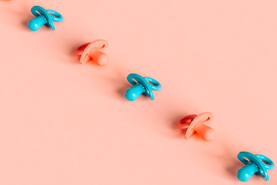 a row of pacifiers in different positions