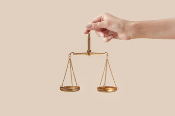 Woman holding golden scales