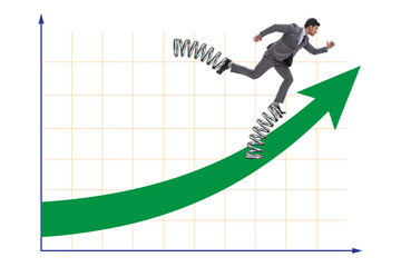 Businessman jumping high on springs