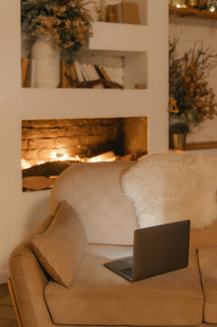 Laptop on sofa in living room
