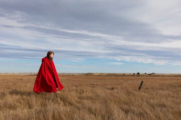 Fall fashion Girl walks with elegant Red cape  coat