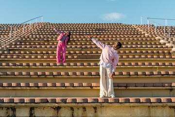 Dancer friends dancing on outdoor tier
