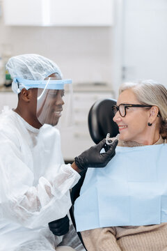 Dentist and patient in dentist office