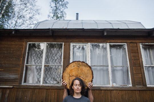 Woman and tree stump slice