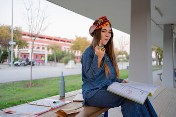 Cool woman studying at university campus 