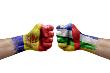 Two hands punch to each others on white background. Country flags painted fists, conflict crisis concept between andorra and central african republic