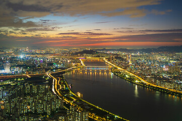 Fototapeta na wymiar Landscape Seoul city at night and the Han River ,South Korea.And the beautiful sunset 