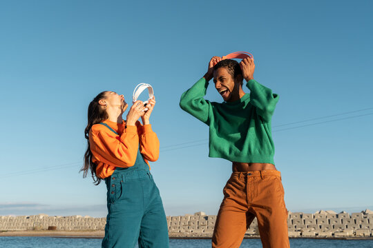 Cool friends listening to music and dancing