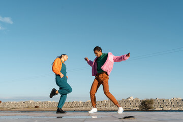 Cool friends listening to music and dancing