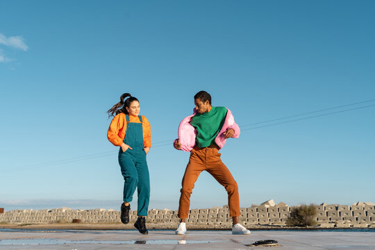 Cool friends listening to music and dancing