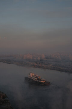 The barge floats on the river
