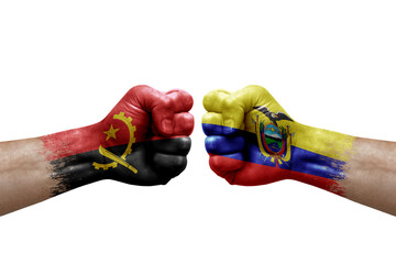 Two hands punch to each others on white background. Country flags painted fists, conflict crisis concept between angola and ecuador