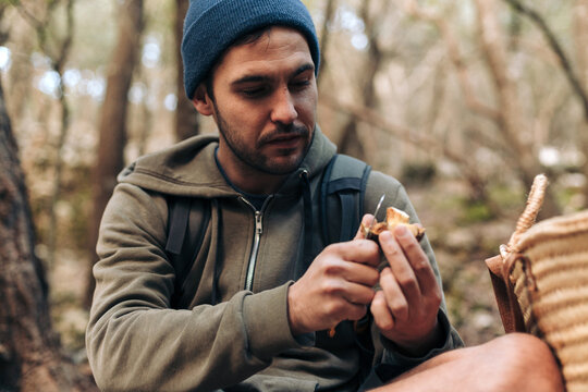 Man cutting a mushroom
