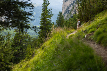 Man hiking on a trail on the Italian Dolomites